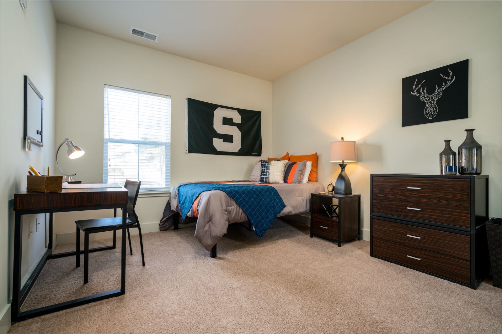 furnished bedroom with study area