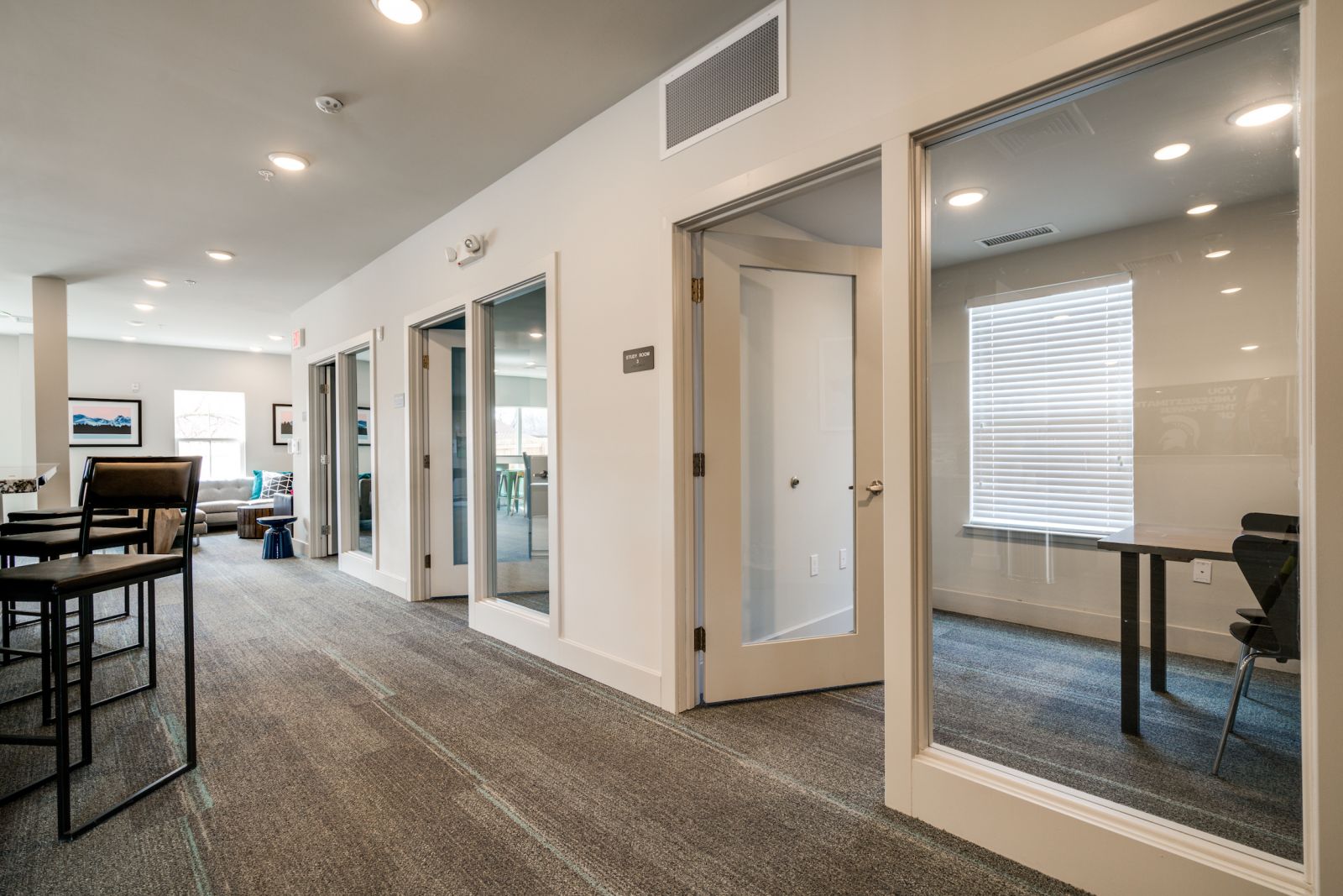 individual glass walled study rooms